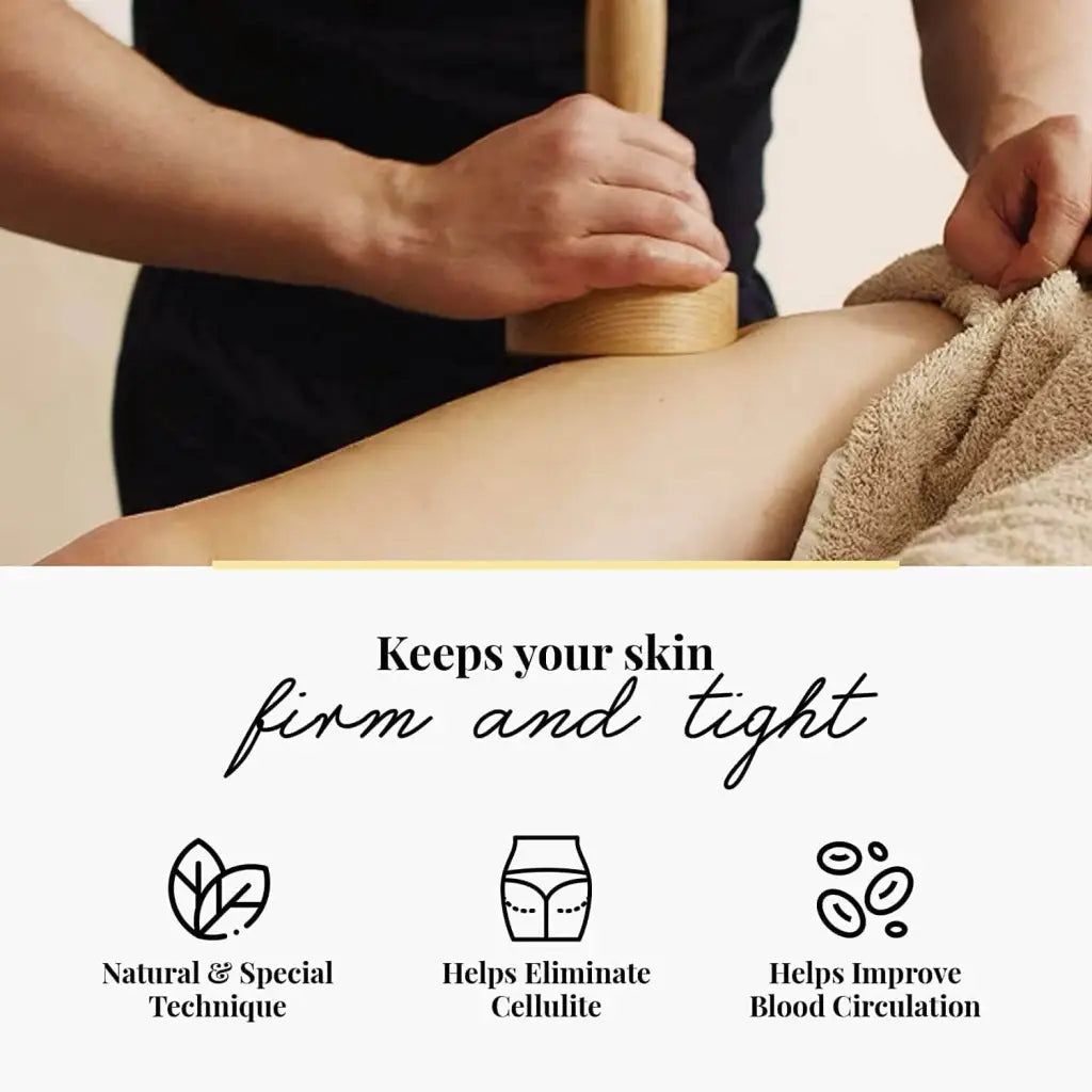 Person receiving a massage on a thigh with a wooden massage cup