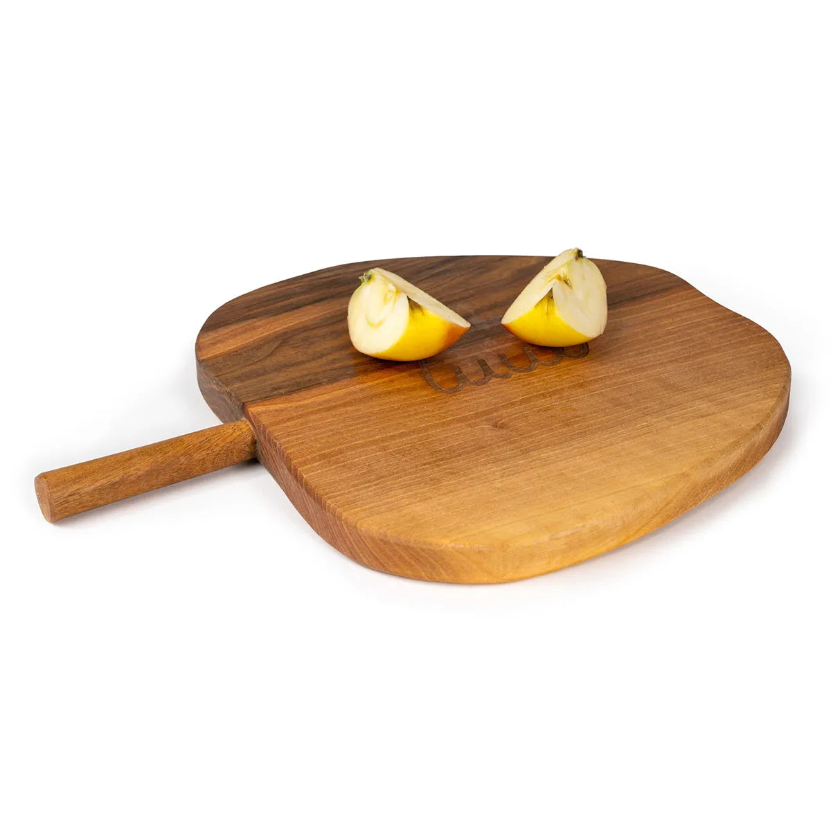 Close-up of rich walnut wood grain on handcrafted apple-shaped cutting board