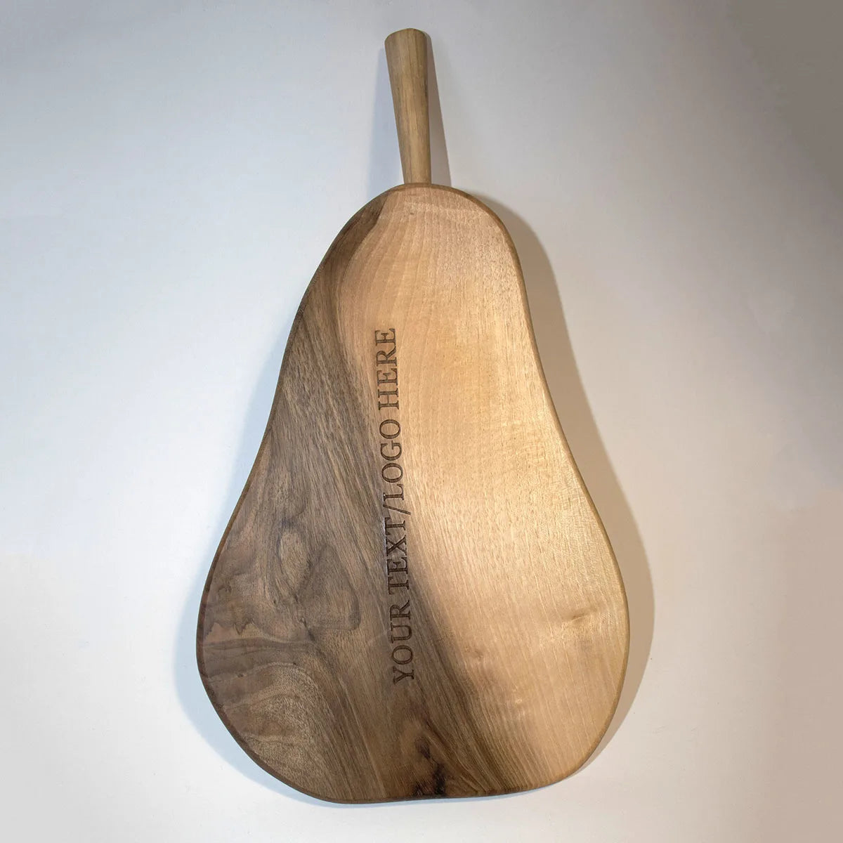 Eco-friendly personalized cutting board showcased alongside kitchen herbs and cooking utensils