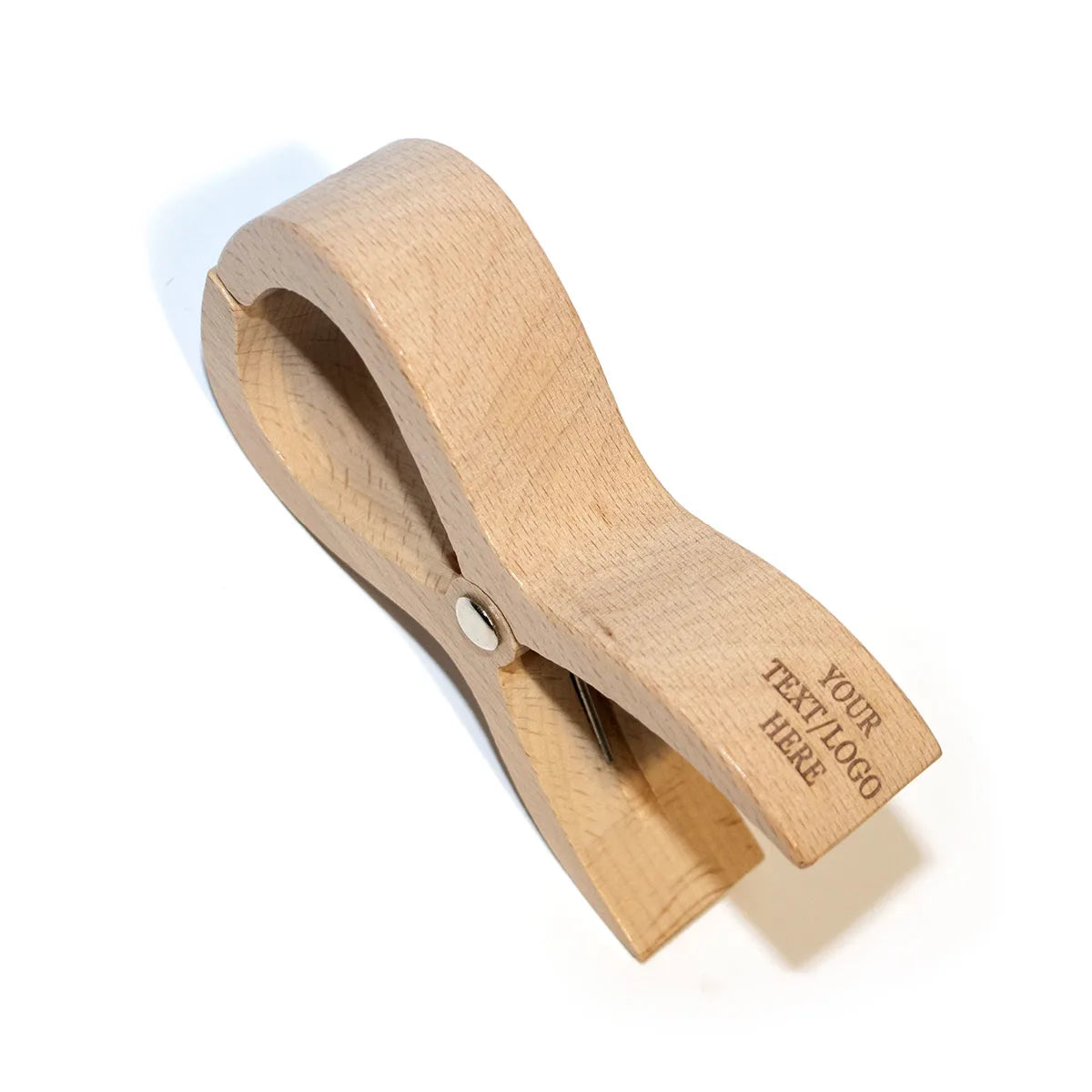 Personalized wooden beach clips with custom engravings securing items on a yacht