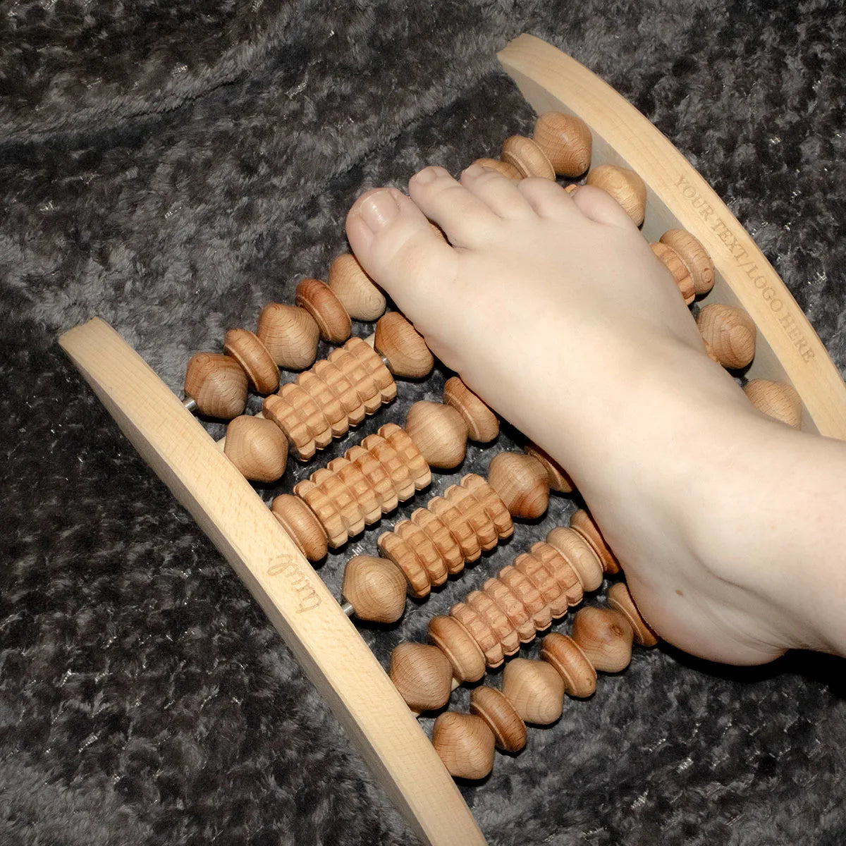 Eco-Friendly Wooden Foot Massager Demonstrating Reflexology Techniques for Holistic Pain Management