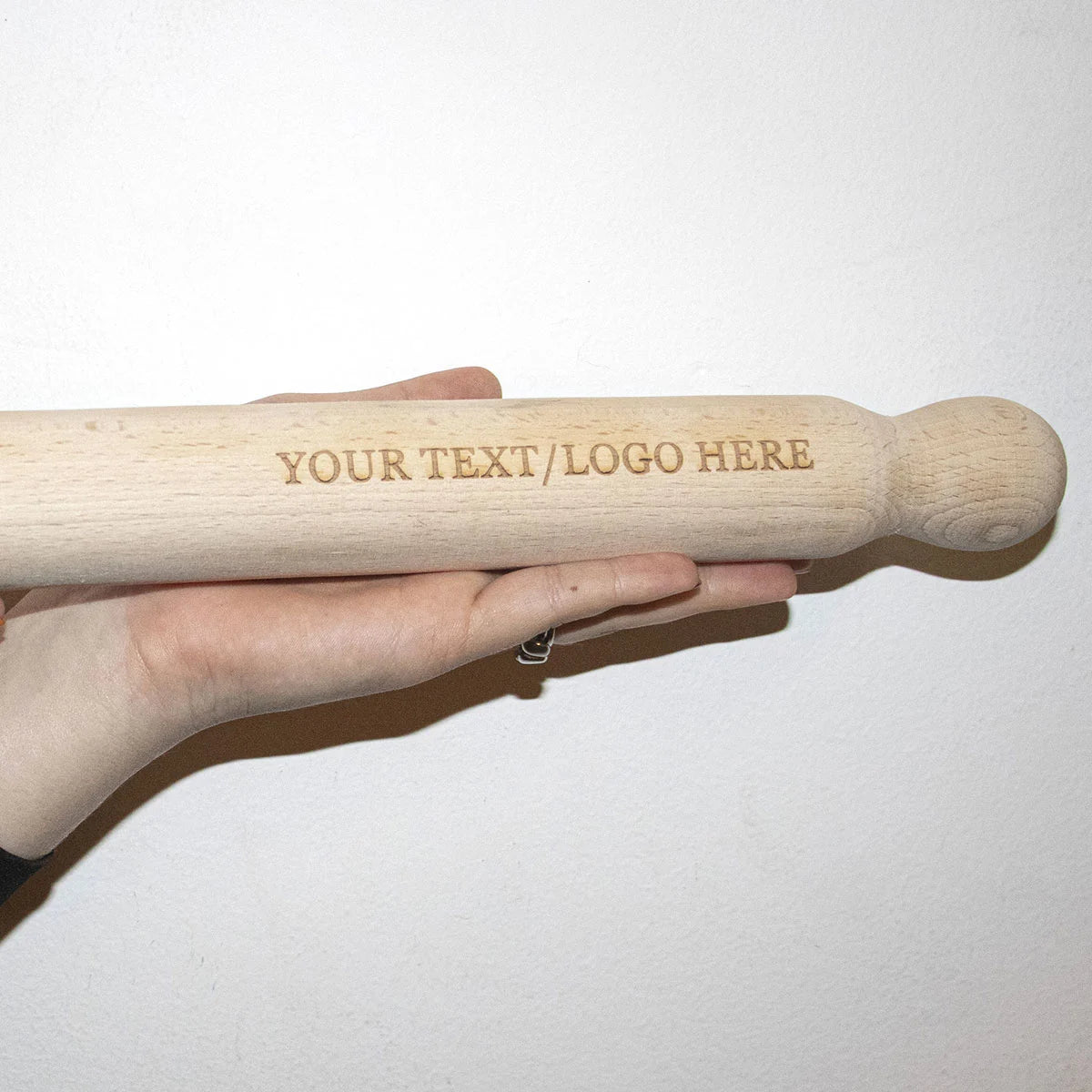Professional Pastry Chef Demonstrating Custom Wooden Rolling Pin Technique for Delicate Pastry Dough
