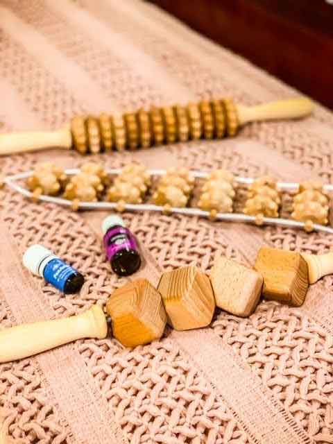 Assorted beechwood back massagers—rope back roller, curved, disk and ball rollers—on a neutral background, Tuuli collection