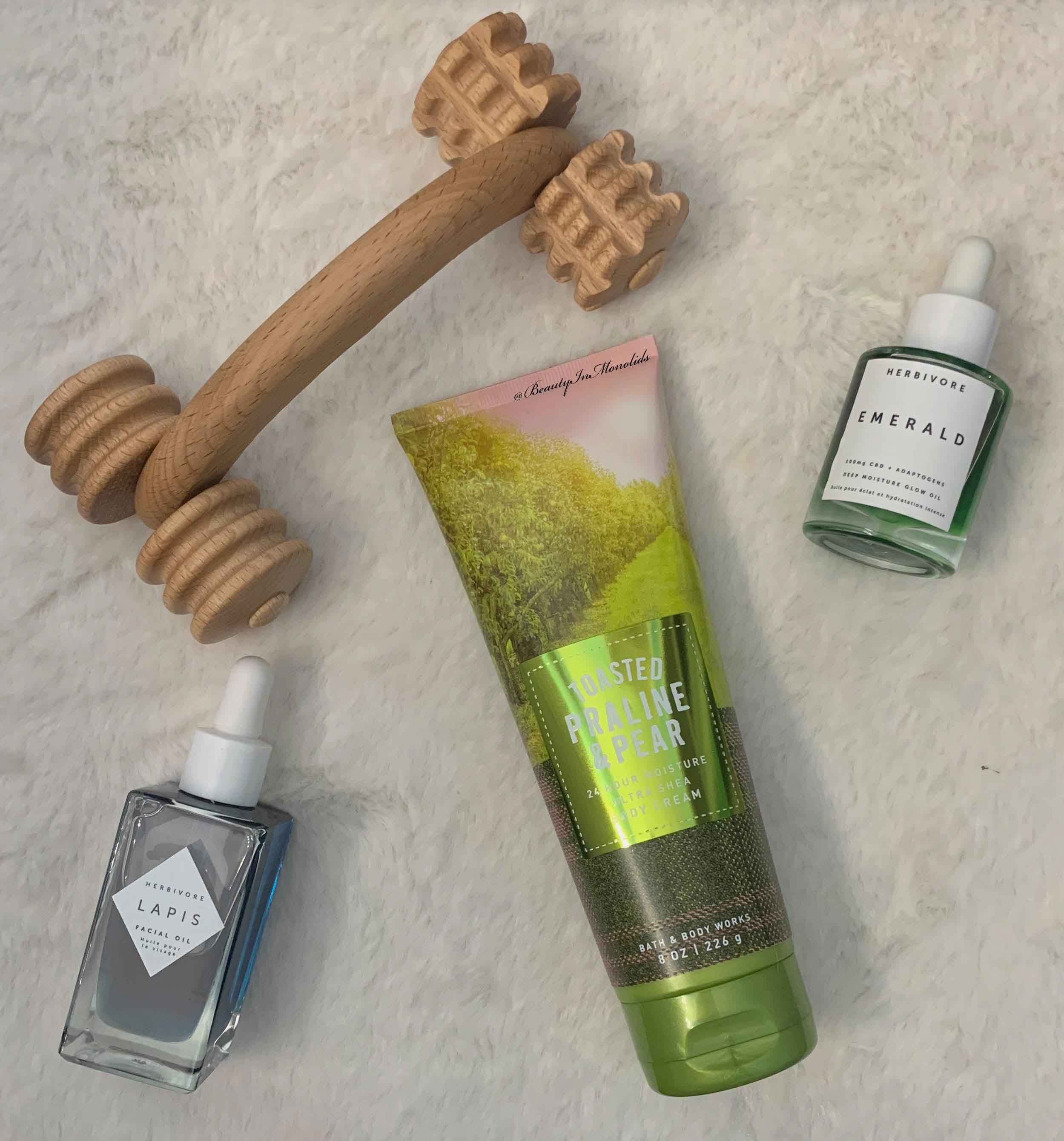Assorted beechwood neck and shoulder massagers—mini T roller, handheld roller, curved and disk profiles—on a neutral background, Tuuli collection