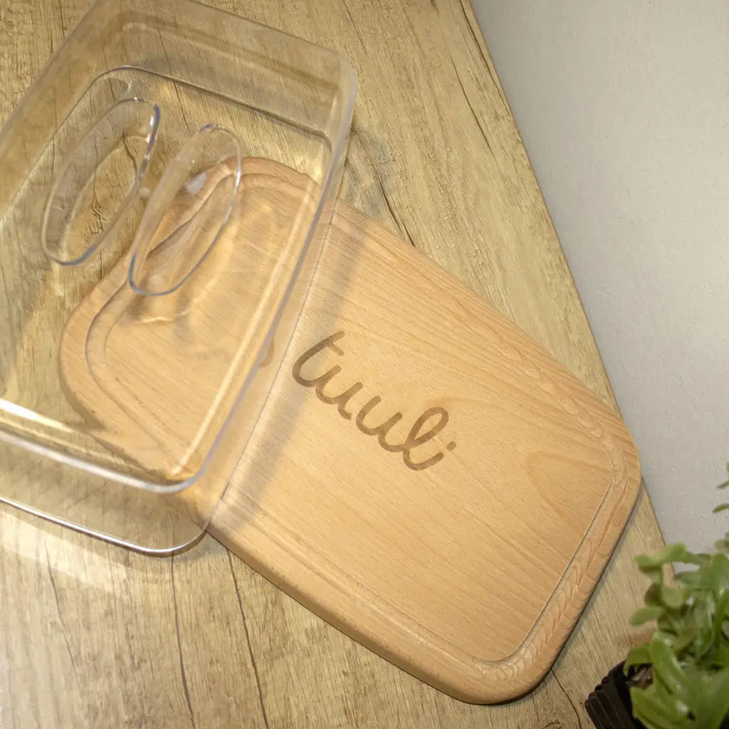 Eco-friendly beechwood cutting board with matching lid showing personalized wedding date engraving